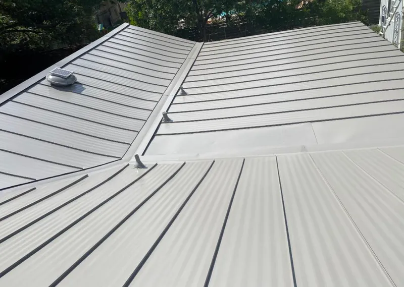 Solar attic fan installed on a metal roof for Roof Ventilation in Spring Valley Lake